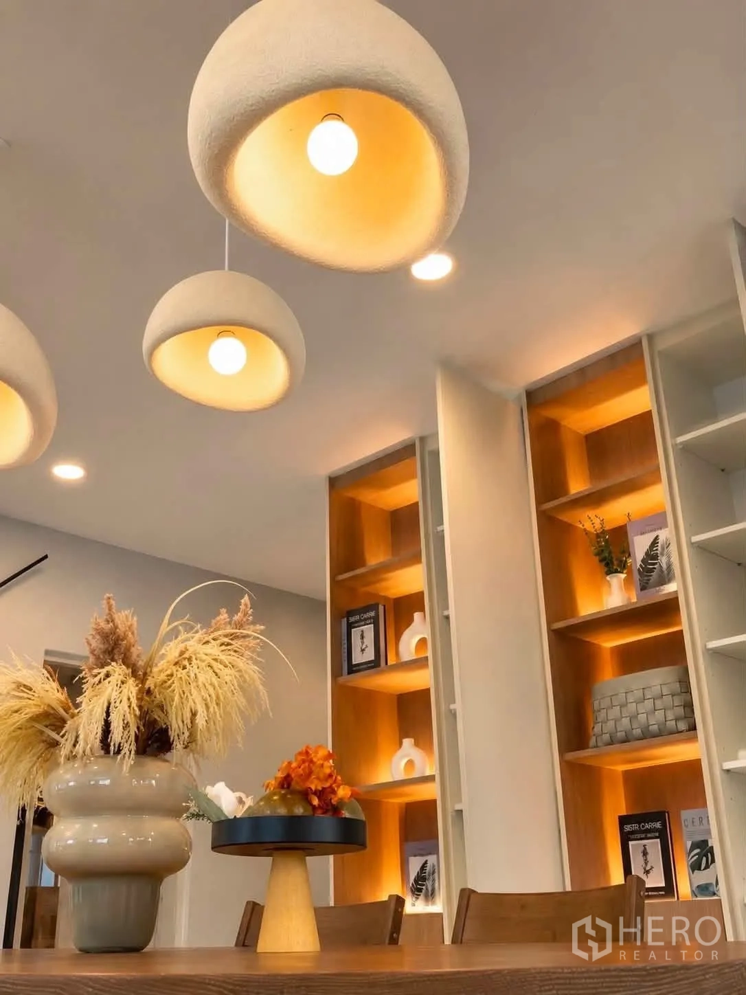 Detached House for rent in Bang Phli, Samut Prakan - Close-up of dome pendant lights and illuminated display shelving.