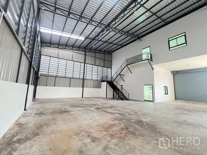 Warehouse for rent or sale - Open storage hall with mezzanine office block and polished concrete floor.