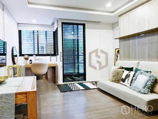 Condominium for sale - Open-plan living space with sofa, desk and floor-to-ceiling window