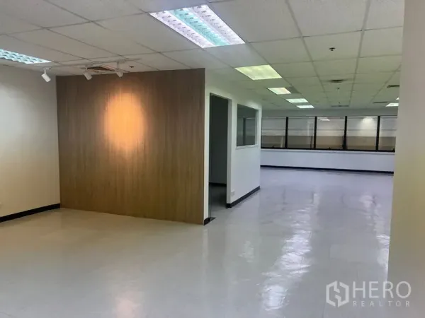 Office Space for rent in Watthana, Bangkok - Spacious office corridor with a wood accent wall and long, open layout.