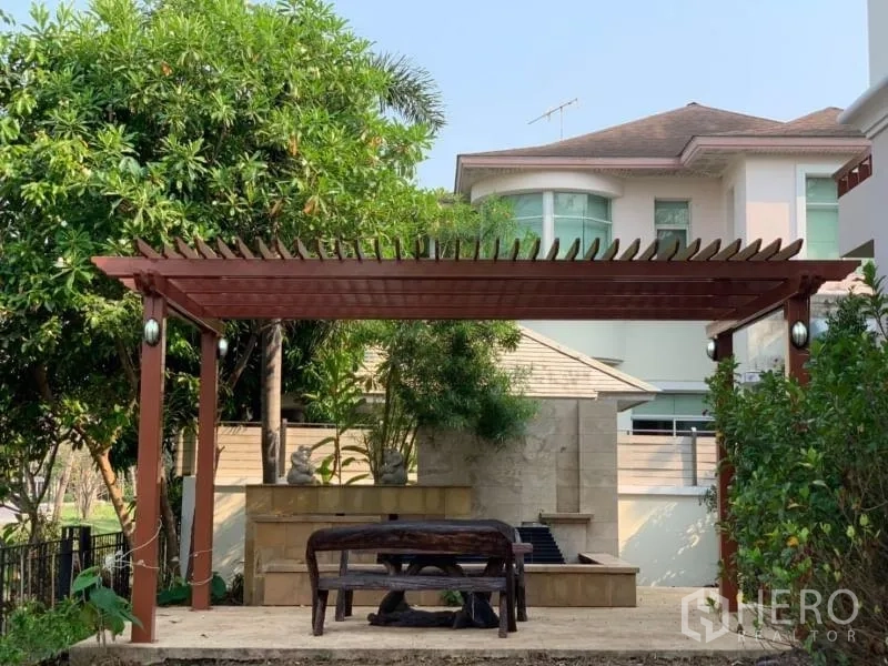 Detached House for rent in Lat Krabang, Bangkok - Shaded pergola and seating area in the landscaped garden.