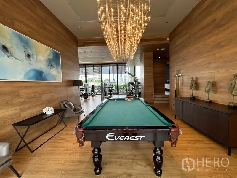 Condominium for sale - Billiards room from another angle with view toward the adjoining gym area.