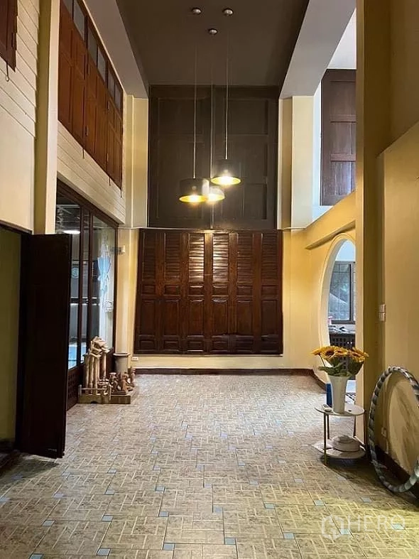 Home Office for rent in Lat Phrao, Bangkok - Large open hall with pendant lights, wood wall panels and tall ceiling