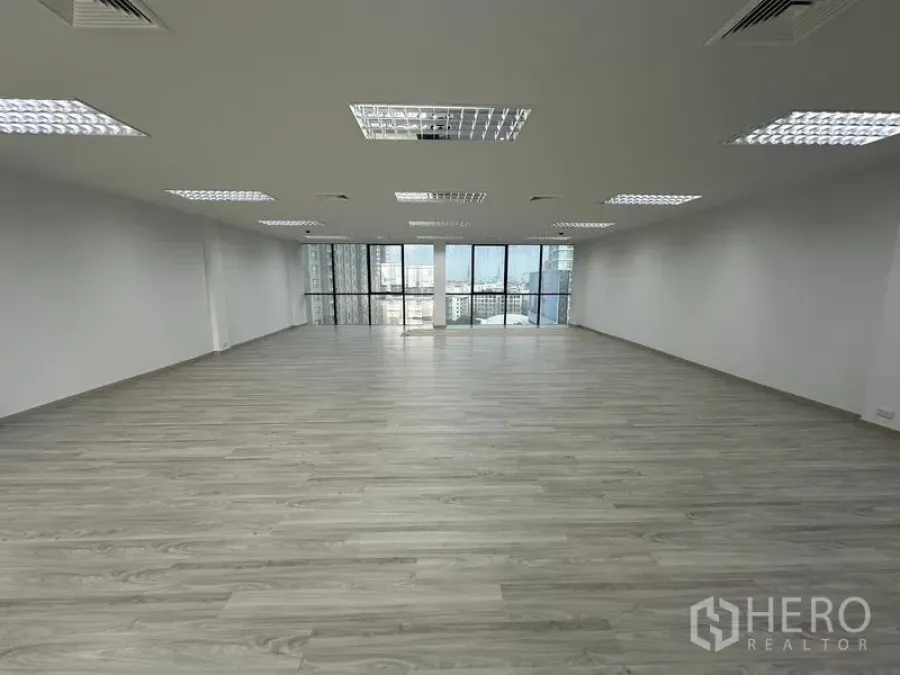 Office Space for rent - Wide open office facing large windows that bring natural light and skyline views.