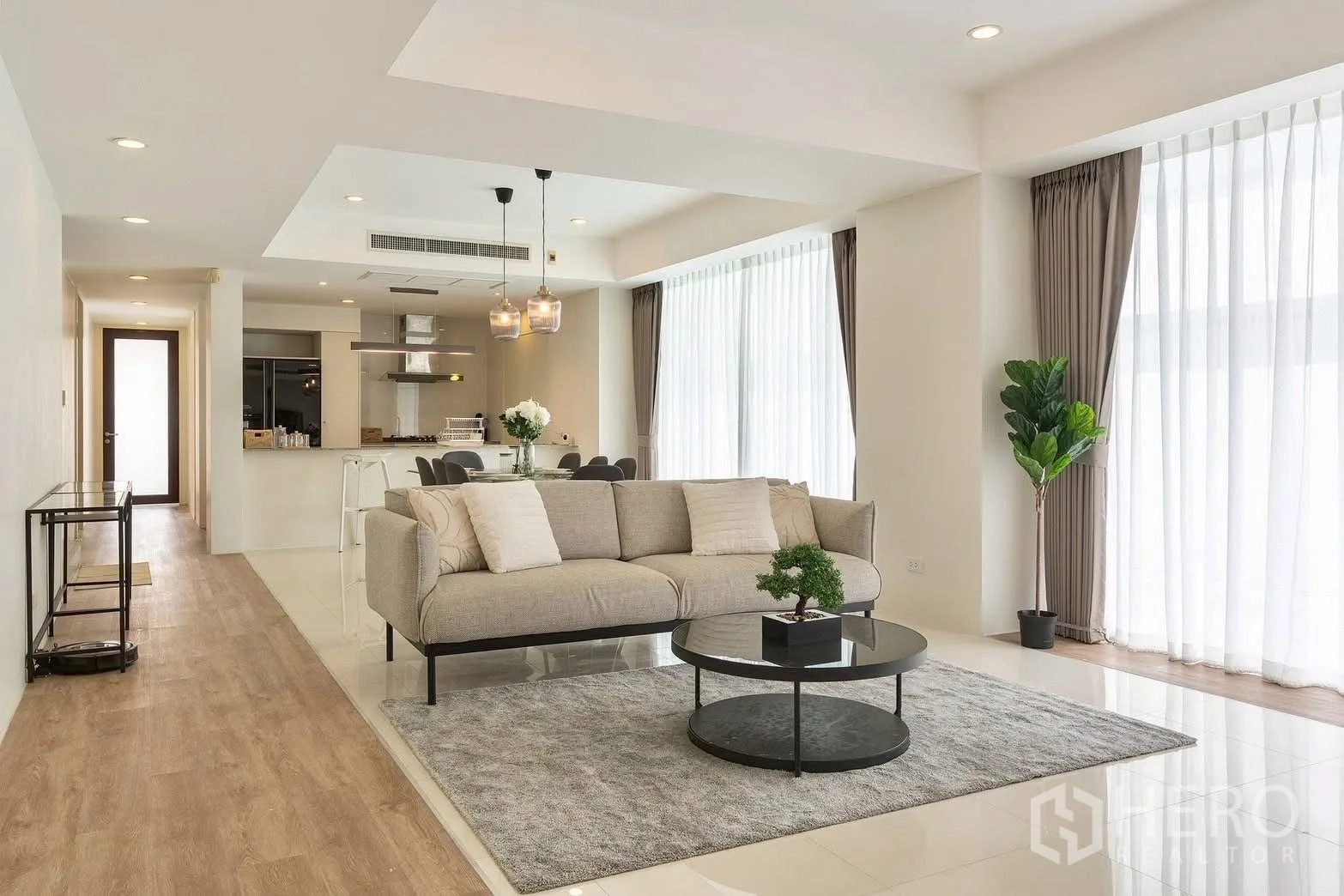 Detached House for rent in Saphan Sung, Bangkok - Open-plan lounge facing the kitchen with pendant lighting.