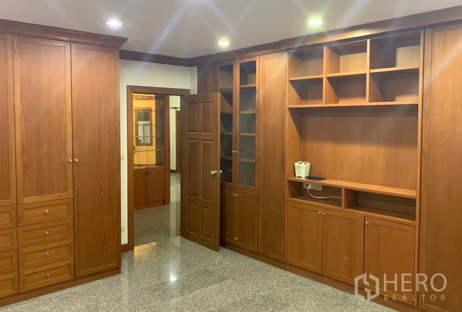 Detached House for rent in Watthana, Bangkok - Bedroom or study with full-height built-in wooden wardrobes and shelves.