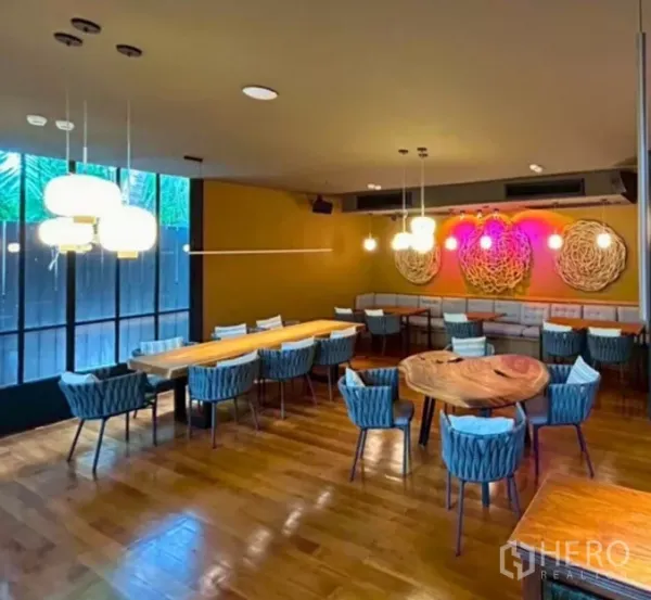 Retail Space for rent in Yan Nawa, Bangkok - Private dining room with pendant lights, wood floors, banquette seating, and modern decor.