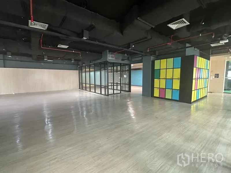 Office Space for rent in Bang Rak, Bangkok - Open workspace beside a bank of multi-colored lockers.