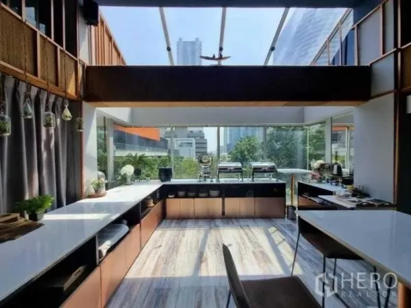 Retail Space for rent in Bang Rak, Bangkok - Bright dining and prep area with skylight, long counters and city views.