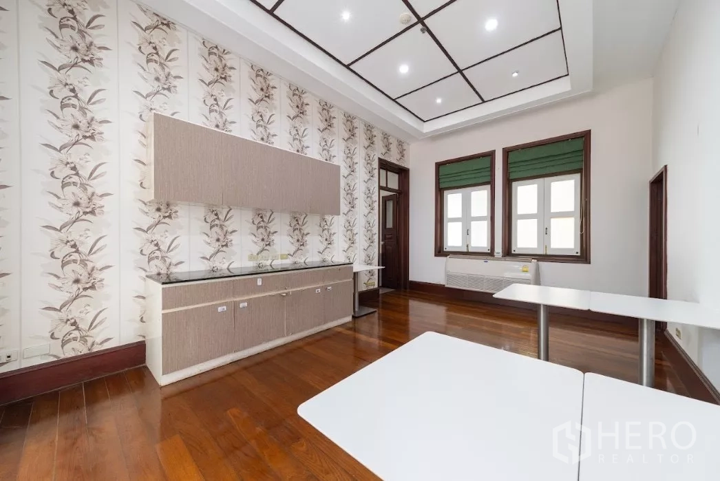 Retail Space for rent in Bang Rak, Bangkok - Bright interior room with wooden floors, floral wall panels and large windows