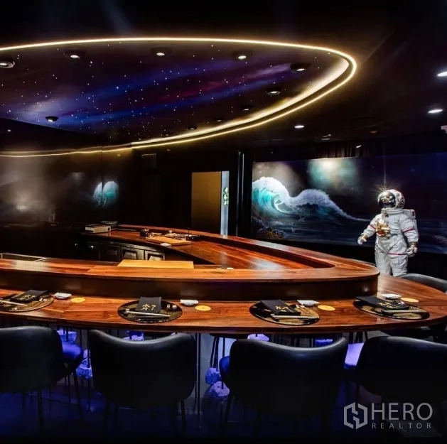 Retail Space for rent in Watthana, Bangkok - U-shaped dining bar with galaxy ceiling and wave mural, featuring astronaut decor.
