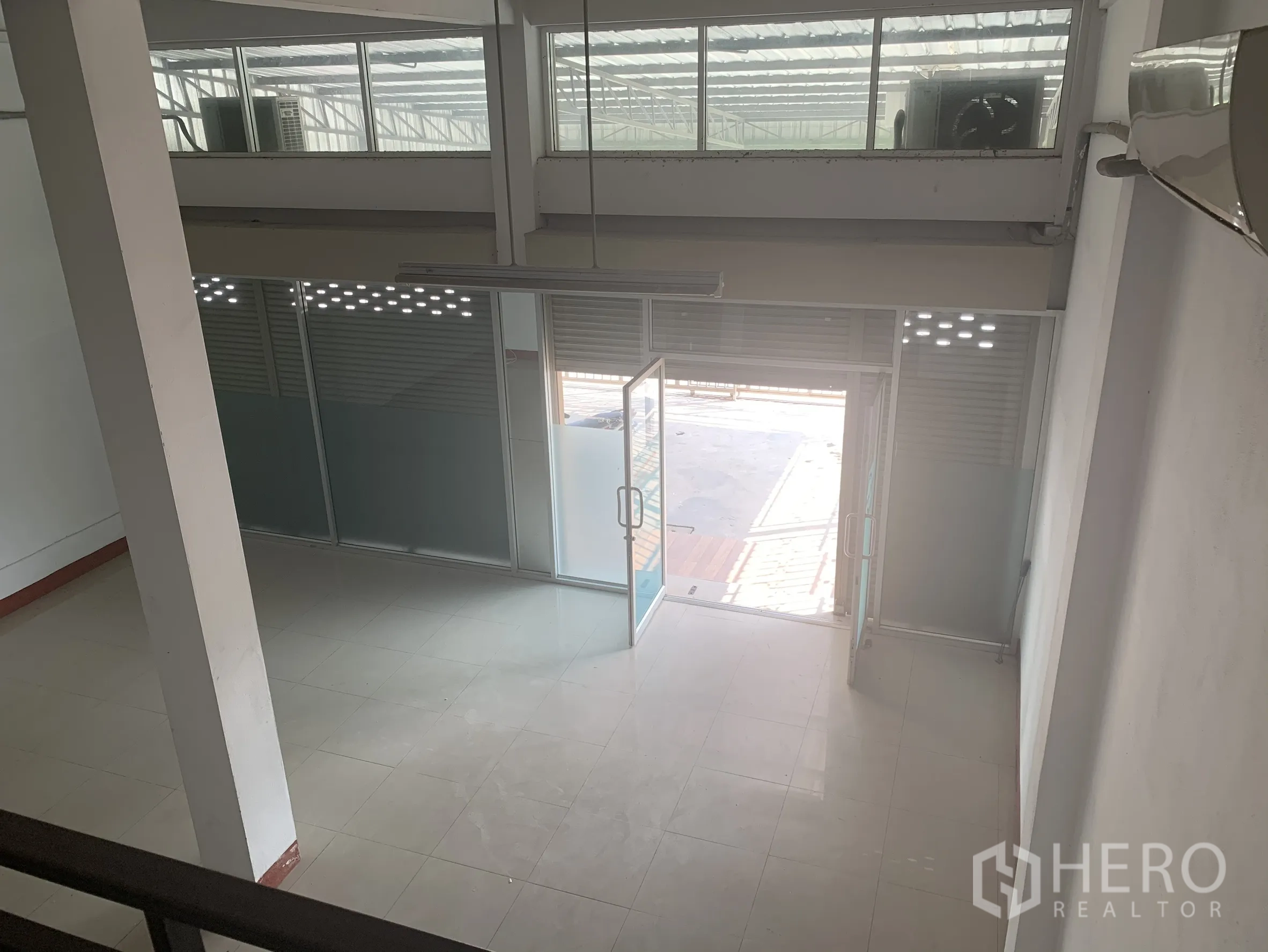 Home Office for rent in Lat Krabang, Bangkok - View from mezzanine over the glass‑fronted entrance and open lobby on the ground floor.