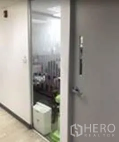 Office Space for rent in Khlong Toei, Bangkok - Private office area with a glass partition and solid door.