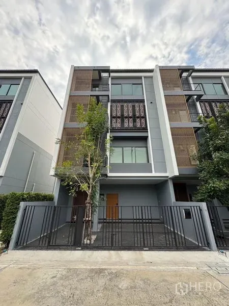 Home Office for rent in Pak Kret, Nonthaburi - Front elevation of a multi-level home office behind a metal fence