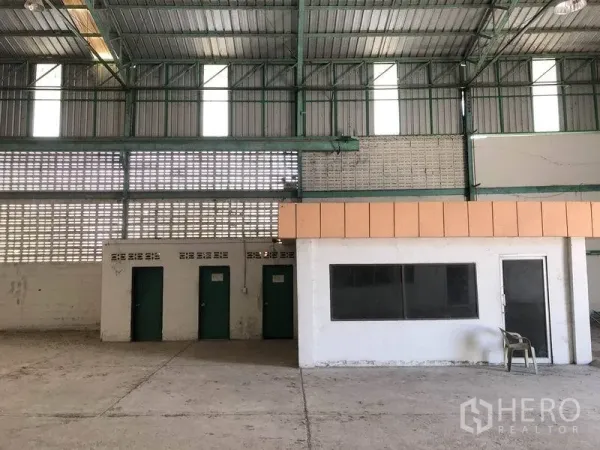 Warehouse for rent in Samut Prakan - Internal office cabin and multiple restrooms inside the warehouse.