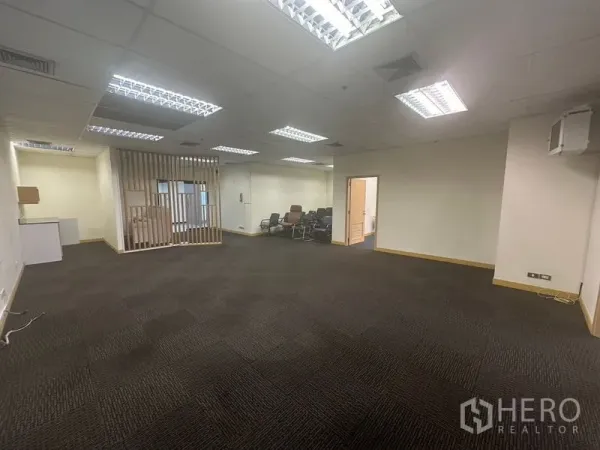 Office Space for rent in Bang Na, Bangkok - Open office space with drop ceiling lights and neutral walls.
