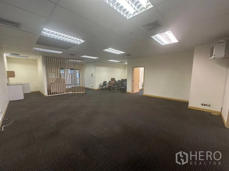 Office Space for rent in Bang Na, Bangkok - Open office space with drop ceiling lights and neutral walls.