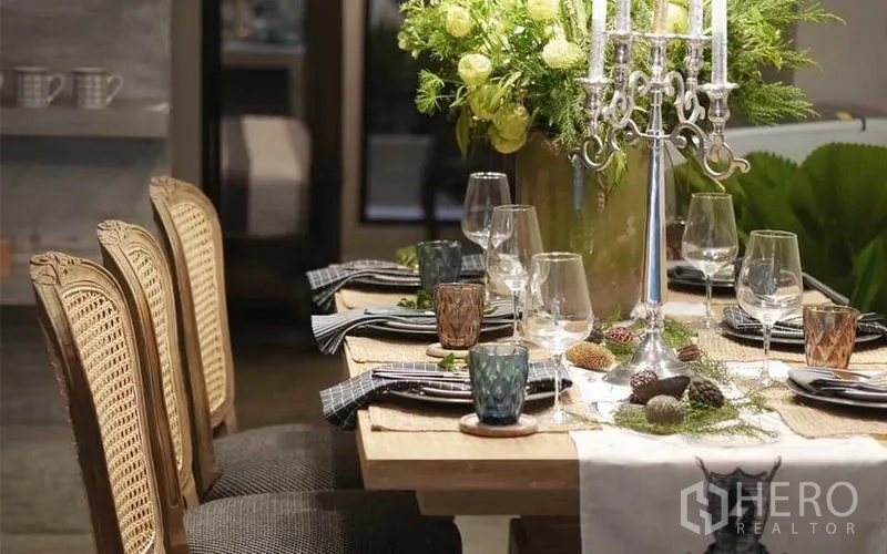 Townhouse for rent in Watthana, Bangkok - Elegant dining table set with candelabra, glassware and a lush floral centerpiece.