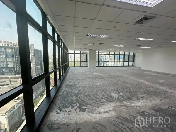 Office Space for rent in Bang Rak, Bangkok - Window-lined office interior showing expansive views and abundant natural light across the open workspace.
