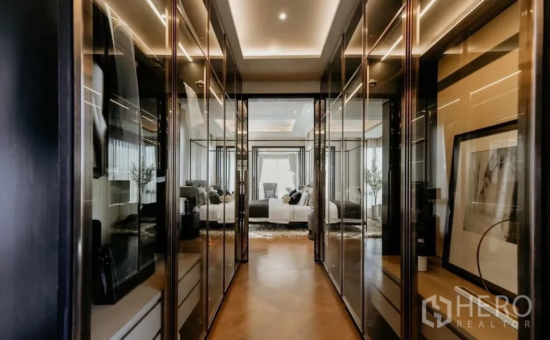 Detached House for sale in Saphan Sung, Bangkok - Walk-through dressing area with glass wardrobes leading into the master suite.