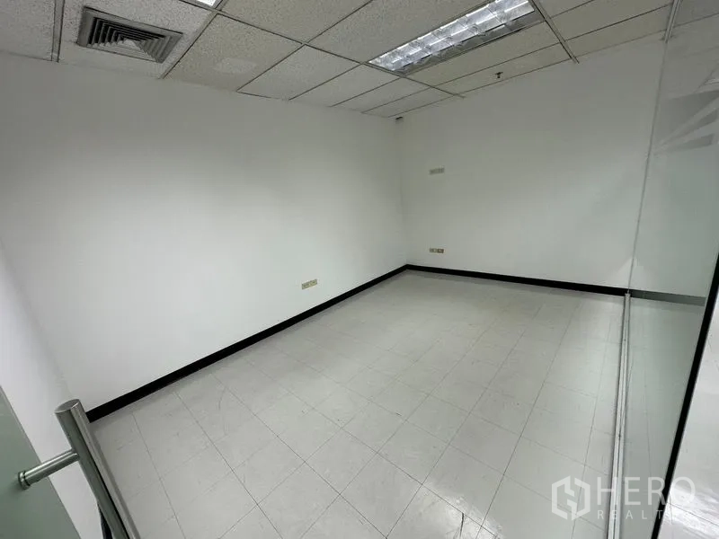 Office Space for rent in Chatuchak, Bangkok - Private meeting room with glass door, white walls and built-in ceiling lights.