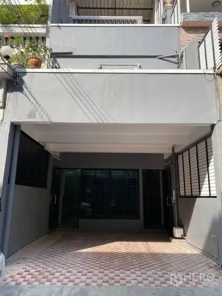 Home Office for rent in Bang Rak, Bangkok - Modern gray home office facade with covered carport and glass entry doors in the Silom area.