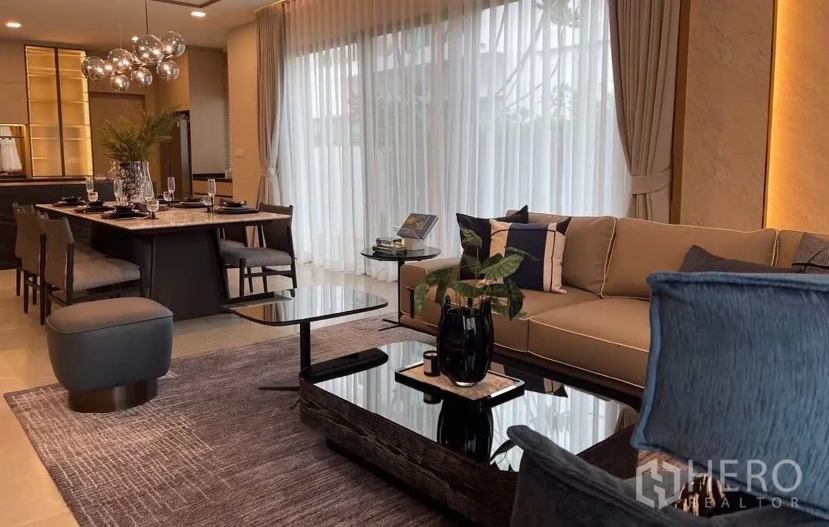 Detached House for rent in Bang Phli, Samut Prakan - Open-plan living and dining space with full-height windows.