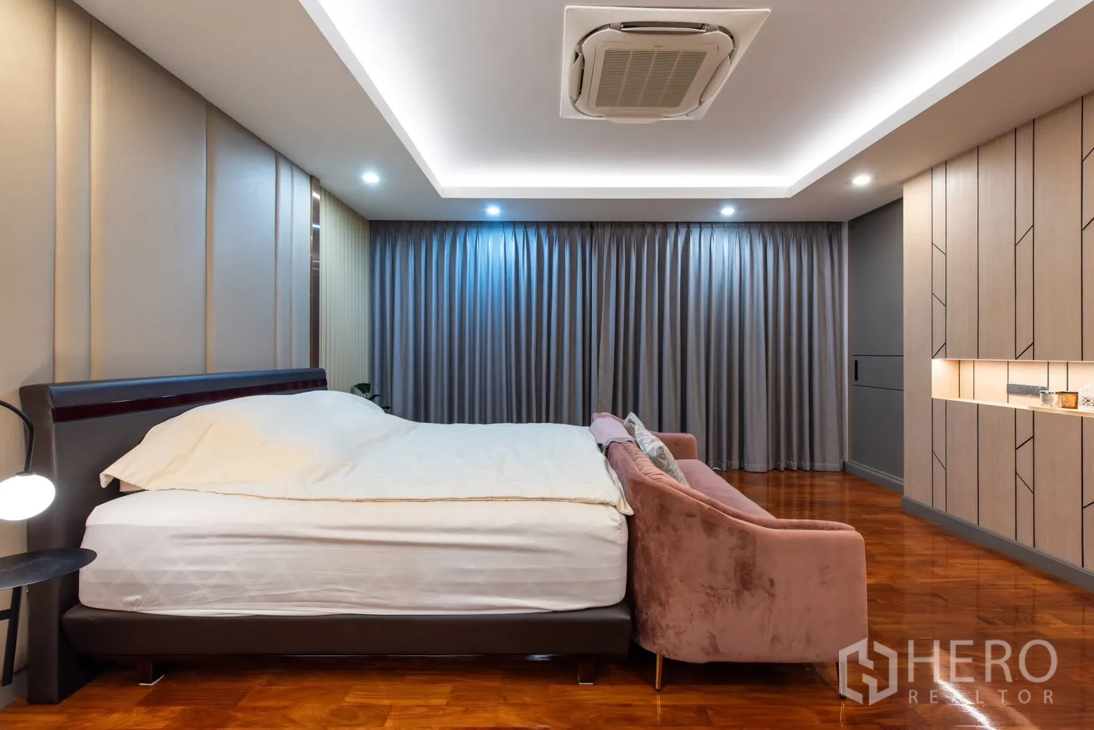 Detached House for sale in Bang Phli, Samut Prakan - Side view of master bedroom showing upholstered sofa and built-in cabinetry.