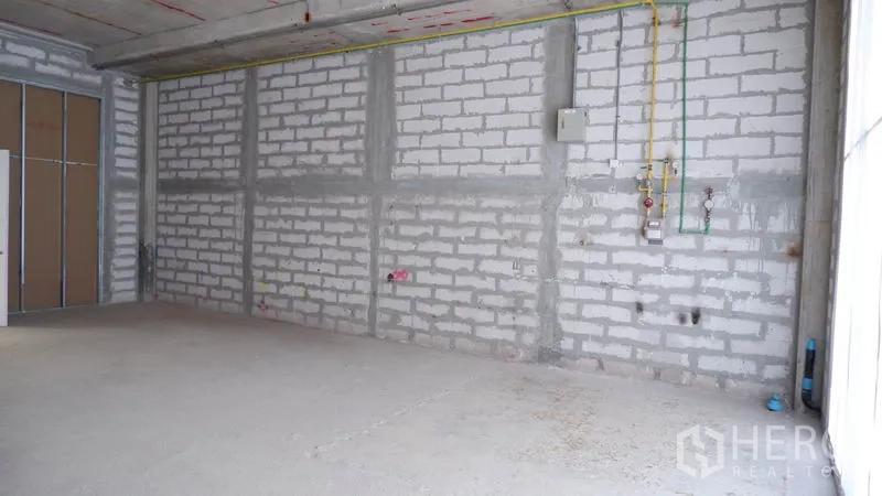 Retail Space for rent in Khlong Toei, Bangkok - Utility wall with electrical panel, gas and water lines, and rough-in points in a retail space.