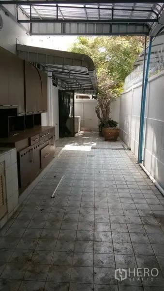 Office Space for rent in Sathon, Bangkok - Covered service corridor with counters and sink adjoining the office.