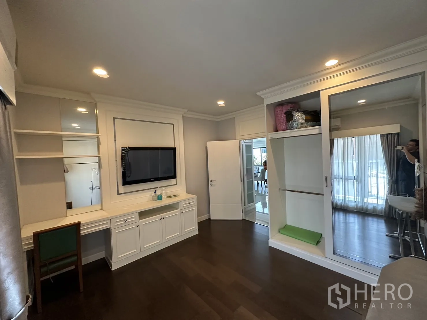 Detached House for rent or sale in Lam Luk Ka, Pathum Thani - Room with built-in desk and sliding mirror wardrobe.