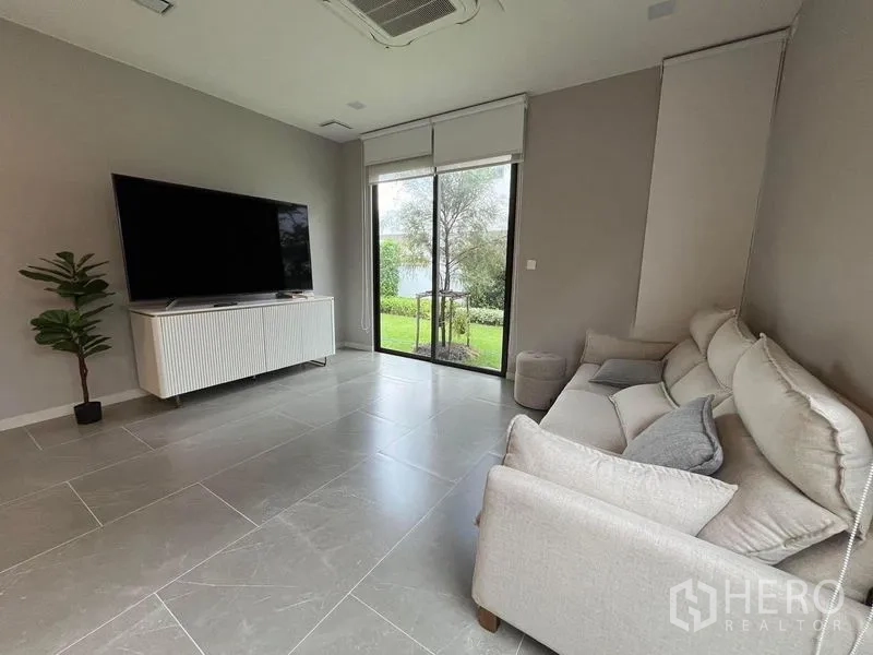 Detached House for rent or sale - Compact guest powder room with square basin, toilet, and rounded mirror by a window.