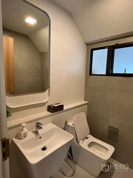 Detached House for rent or sale - Front elevation of the contemporary two-storey home with gate and sheltered car parking.