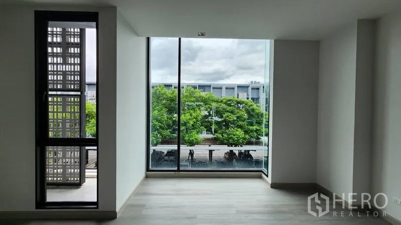 Home Office for rent - Corner window area offering street and tree views.