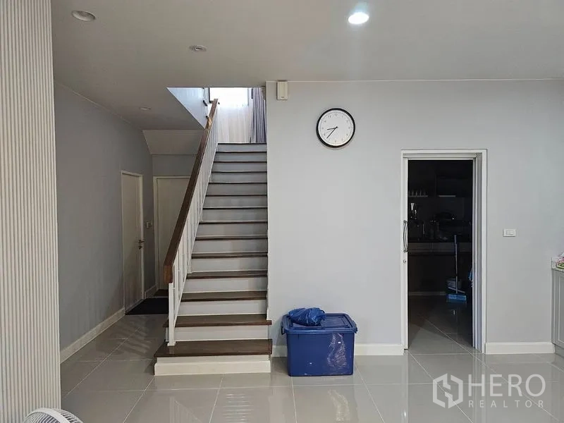 Detached House for rent or sale in Lam Luk Ka, Pathum Thani - Stair hall with wooden steps and storage doors