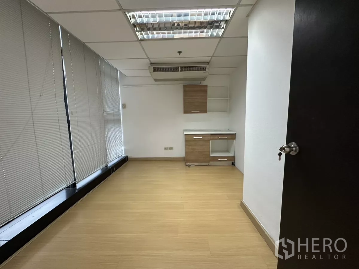 Office Space for rent in Watthana, Bangkok - Private office with window blinds and a small built-in pantry cabinet.