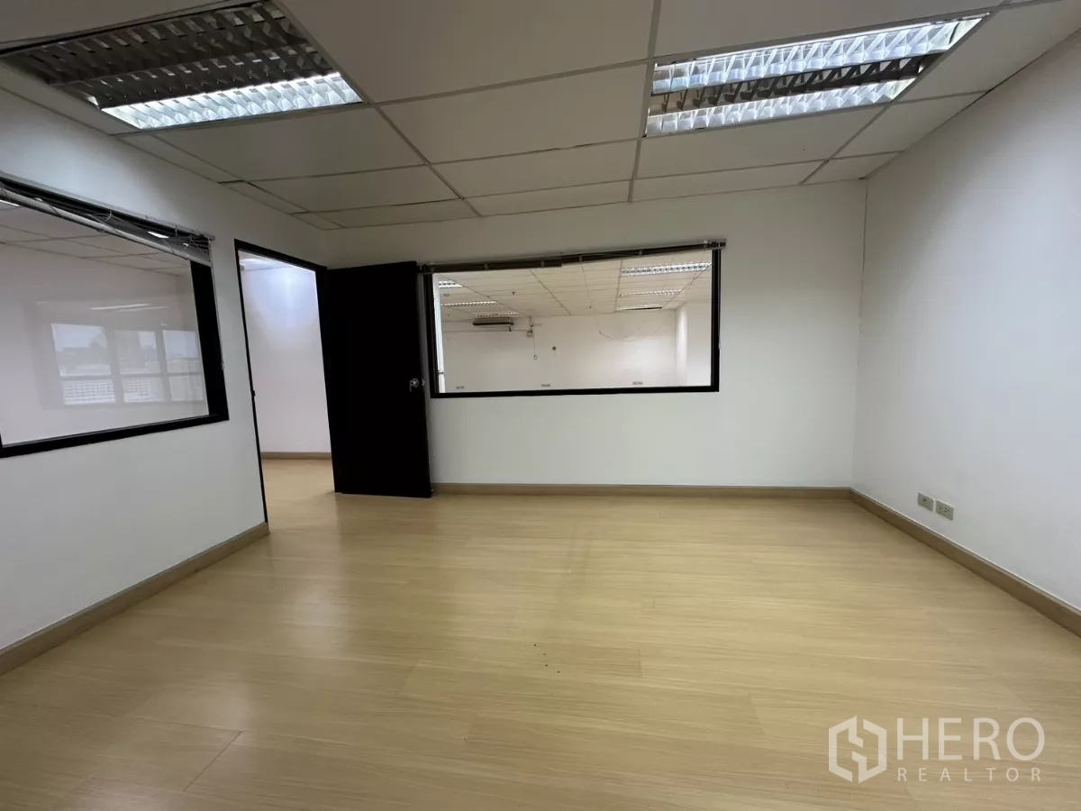 Office Space for rent in Watthana, Bangkok - Enclosed meeting room with interior glass looking into the open workspace.
