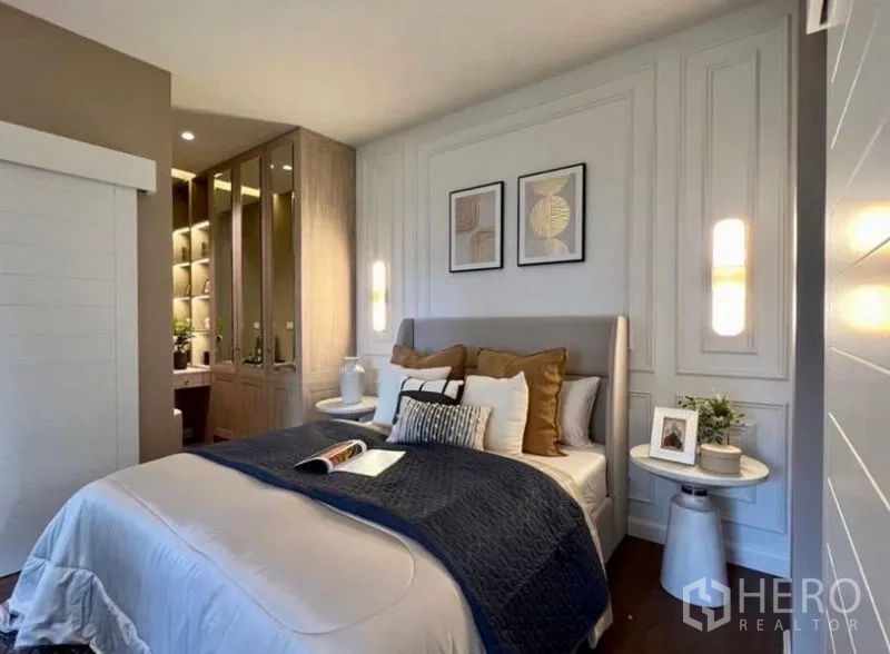 Detached House for sale in Bang Phli, Samut Prakan - Elegant bedroom with paneled walls, soft lighting and access to walk-in wardrobe.