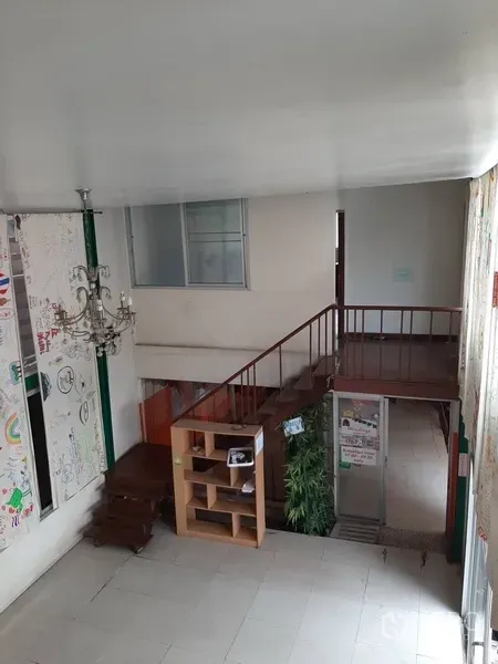 Retail Space for rent in Watthana, Bangkok - Mezzanine outlook over entry hall showing chandelier, stairs and a glass entryway.