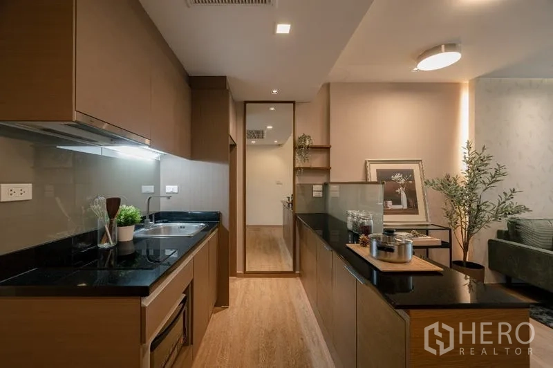 Condominium for sale - Galley kitchen with long island opening to the living room.