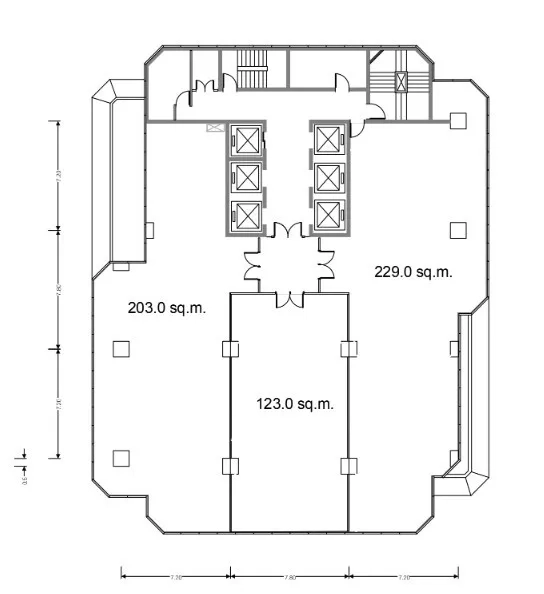 Office Space for rent - Floor plan showing 555 sq.m layout with multiple elevator cores and partitioned zones.