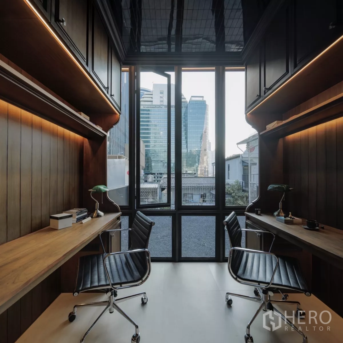 Office Space for rent in Bang Rak, Bangkok - Dual workstations facing a floor‑to‑ceiling window with Bangkok skyline view