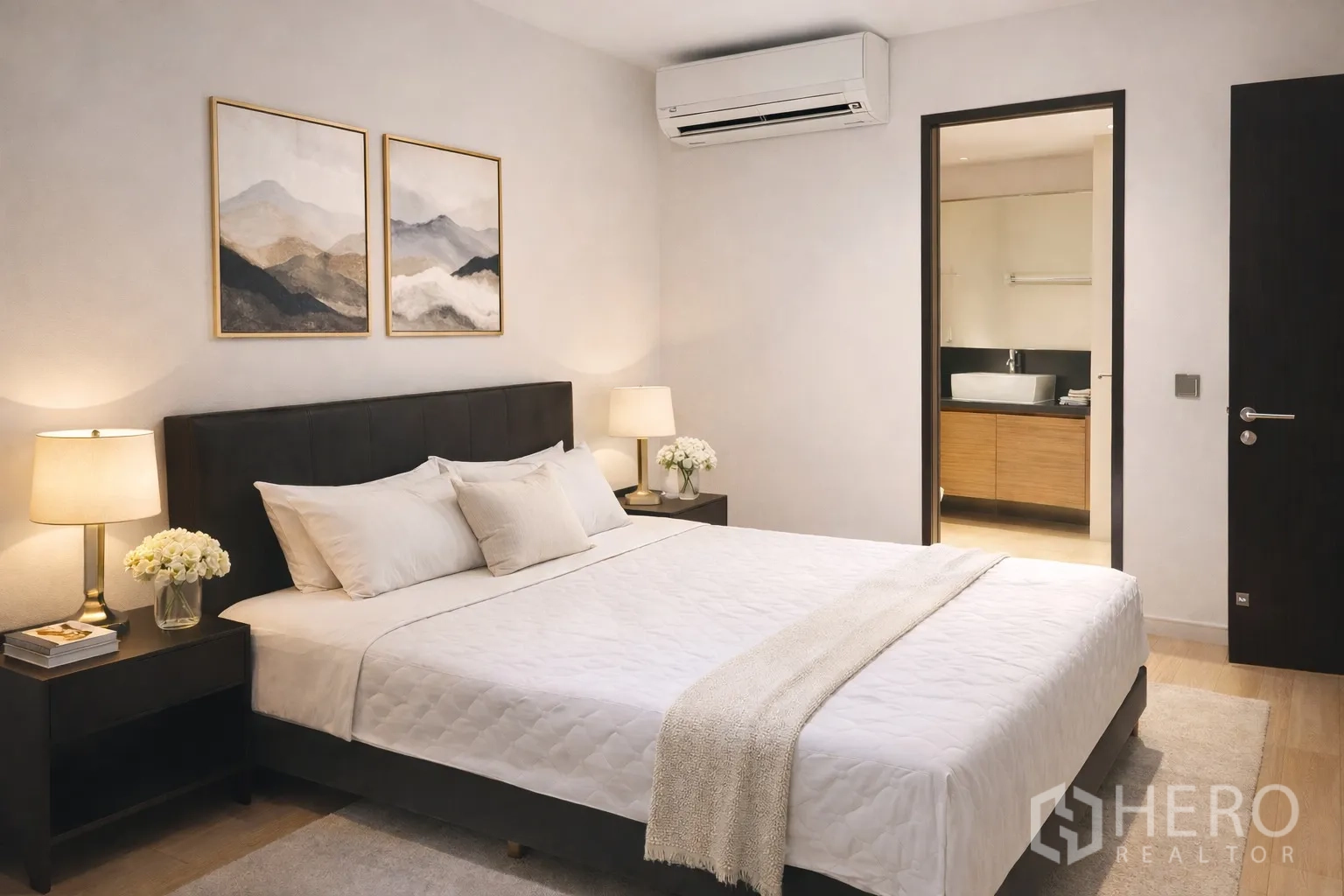 Condominium for rent in Watthana, Bangkok - City skyline seen through a large bedroom window with blue glass tower.