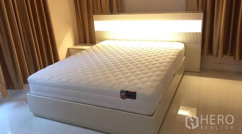 Detached House for rent or sale - Bedroom with illuminated headboard and queen-size bed.
