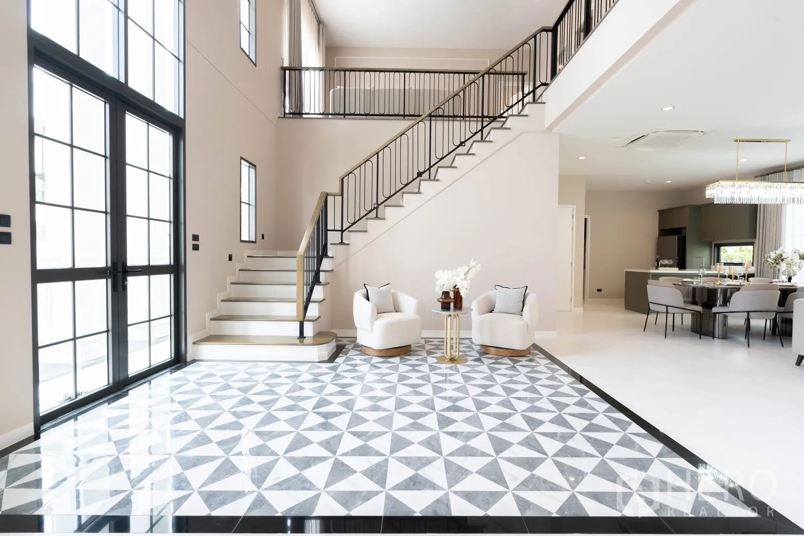 Detached House for rent in Bang Phli, Samut Prakan - Grand double-height foyer with patterned marble floor and staircase.