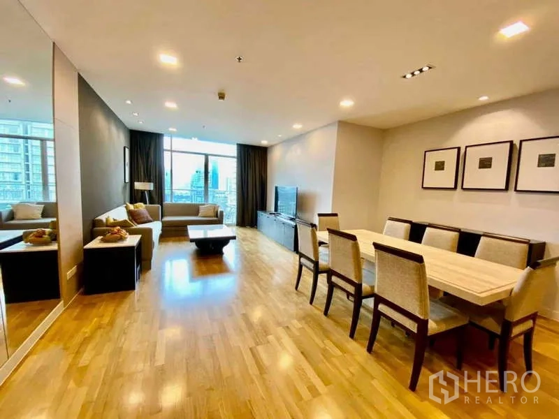Condominium for rent or sale in Sathon, Bangkok - Open-plan living and dining area with sofa set and balcony city outlook.