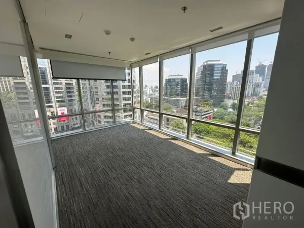 Office Space for rent - Corner meeting room with wraparound floor-to-ceiling windows providing panoramic city views.