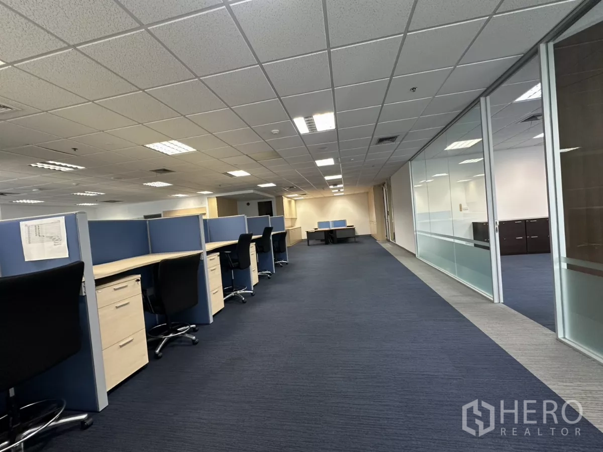 Office Space for rent in Watthana, Bangkok - Long corridor of the open-plan office with glass meeting rooms and rows of workstations.
