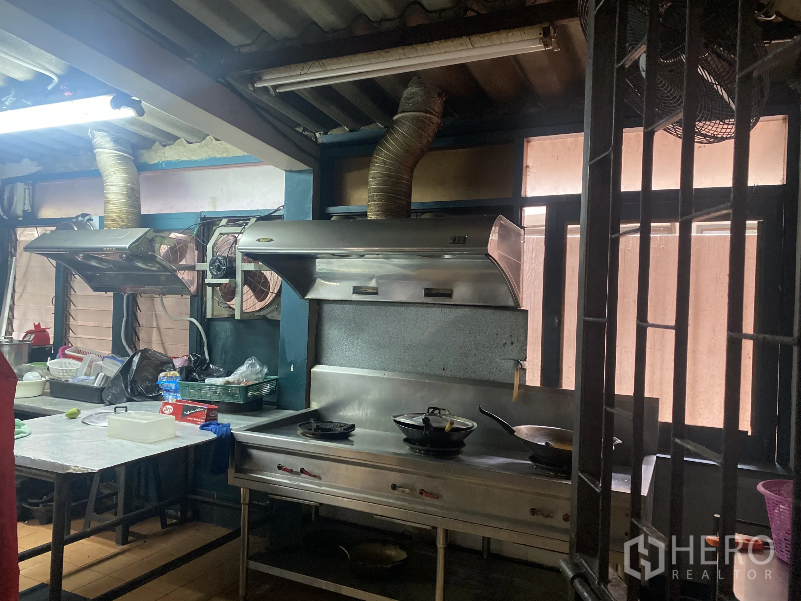 Retail Space for rent in Watthana, Bangkok - Commercial kitchen with stainless ventilation hoods, stoves and worktable.