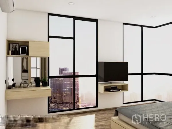 Condominium for rent or sale in Watthana, Bangkok - Bedroom corner with floor-to-ceiling windows showing Bangkok city view, wall-mounted TV, and a vanity desk.